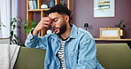 Home, tired and man with headache, stress and overworked with pain in living room. Person, apartment and guy on sofa, migraine and burnout with fatigue, exhausted and strain with pressure on temple