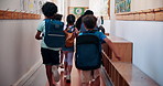 School, students and children in hallway running with backpack, excited for learning and education from back. Energy, fun and knowledge with happy, friends and together outside classroom for lesson