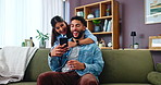 Couple, phone and laugh on sofa with smile, social media and funny gossip story in home. Woman, man and smartphone in living room for storytelling, comedy and celebrity news in timeline on internet