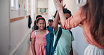 Happy, teacher and children with high five at school for learning motivation, study support or enter classroom. Education, educator and greeting students at doorway for welcome, development or lesson