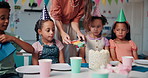 Birthday, cake and party with children at school together for celebration, event or milestone. Education, development or growth with students and teacher in classroom for dessert, eating or fun