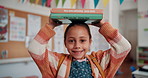 Happy, face and child with books in classroom for literature learning, reading or development. Scholarship, kid and portrait of girl student with storytelling education at elementary school.