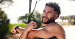 Man, warm up and arms in nature for fitness preparation, outdoor and thinking on wellness goals. Mountain, road and stretching muscle for exercise in countryside, planning and getting ready to train