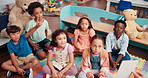 Education, answer and group of children, learning and teacher with questions in classroom or school. Elementary, students and teaching kids for knowledge, growth and development with quiz or lesson