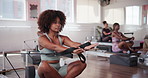 Pilates, reformer and gym with woman in class for workout, health and balance machine. Exercise, wellness and core strength with people in yoga studio for resistance, self care and flexibility