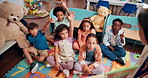 Education, answer and group of children, hands and teacher with lesson for knowledge and learning. Storytelling, students and teaching kids with book, growth and development with fairytale in class