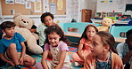 Education, talking and group of children, learning and teacher with questions in classroom or school. Elementary, students and teaching kids for knowledge, growth and development with lesson or smile