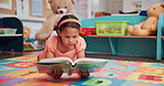 Girl, student and reading book in school, learning english and language development at academy. Child, education and fantasy story for vocabulary growth in class, fiction and clever person studying
