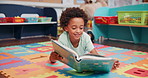 Child, student and reading book in school, learning english and language development at academy. Boy, education and fantasy story for vocabulary growth in class, fiction and clever person studying