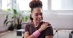 Woman, shoulder pain and injury with discomfort at gym for muscle tension, sprain or pressure at health club. Active, female person or athlete with sore joint, ache or inflammation for fitness strain