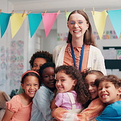 Woman, face and hug children in classroom, teacher and support with ...