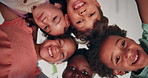Face, huddle and smile of kids in classroom together for bonding, development or learning from below. Diversity, education and group of happy student friends at school for growth or scholarship