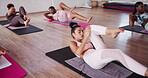 Bicycle crunches, active and women in gym, exercise and training for coordination in class or balance. Fitness, serious and twisting motion for core strength, flexibility and routine for pilates