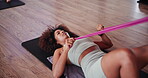 Resistance band, stretching and fitness with woman in class for workout, health and pilates studio. Exercise, wellness and warm up with person on yoga mat on gym floor for leg muscle, ready and start