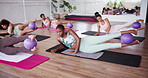 Medicine ball, pilates group and people for gym, legs exercise and activity for club. Weight equipment, yoga class and women for muscle training, fitness and workout for body goals and flexibility