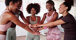 Yoga, friends and huddle with celebration for fitness, motivation or solidarity for wellness. Studio, excited women and group of people with hands stack, applause or synergy with support for exercise