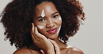 Face, African woman and lotion for skincare, cosmetics and spf cream on white studio background. Portrait, black model and silly person with dermatology, sun protection and treatment for funny joke