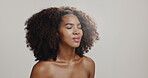 Skincare, spray and smile with woman in studio for beauty, hydration and self care. Cosmetics, glow and dermatology with African person on white background for shine, spa treatment and facial mist