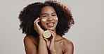 Skincare, face cream and black woman with lemon in studio for organic cosmetics, beauty and wellness. Dermatology, white background and portrait of person with fruit for health, benefits or vitamin C