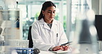 Woman, scientist and typing on computer in lab communication, research and medical results. Female person, pc and feedback report of experiment, review checklist and healthcare information on vaccine