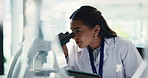 Scientist, microscope and woman with tablet in lab for research, medicine development and experiment. Biotechnology, science and microbiology for medical test, healthcare innovation or pharma study