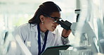 Woman, scientist and microscope on tablet in lab for research, study bacteria and medical results. Female person, biotechnology and digital for experiment notes, growth feedback and sample of vaccine