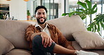 Smile, relax and face of man on sofa in home for weekend, rest and afternoon break. Happy, laughing and portrait of person on couch with confidence, positive attitude and pride in living room