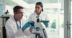 People, scientist and microscope with tablet in lab for research, studying bacteria and medical results. Team, biotechnology and digital with experiment notes, growth feedback and sample for vaccine