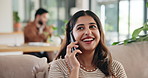 Woman, phone call and happy on couch for talking, excited and listening on break in living room. Person, smartphone and smile with contact, conversation and gossip with story on sofa at apartment
