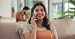 Woman, phone call and happy on sofa for talking, excited and listening on break in living room. Person, smartphone and smile with chat, conversation and gossip with story on couch at apartment