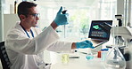 Scientist, pipette or man with chemical to research, dna analysis or happy with experiment results. Beaker, science or dropper for medical test, healthcare innovation or pharma study on laptop in lab