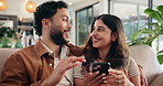 Happy couple, relax and phone in home for discussion, online shopping and purchase together. Man, woman and mobile on sofa for credit score, financial loan and banking with account on internet app