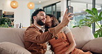 Happy couple, kiss and selfie in home for love, bonding and talk together for memory of marriage. Man, woman and picture for photography on sofa, social media or romance with partner in relationship