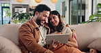 Couple, tablet and laugh on sofa, relax and scroll on web with social network, meme and talk in living room. People, man and woman with touchscreen, application and funny post in lounge at apartment