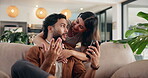 Couple, hug and chat with phone for social media, meme or bonding in living room at home. Man, woman and relax with smile on smartphone for communication, embrace and love on sofa with gossip story