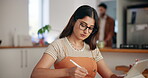 Woman, writing and notes on tablet at house for research, schedule update and editing blog. Female person, journalist or reminder for information, article feedback and to do list of publishing agency