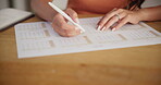 Hands, woman and notes on calendar planner for planning schedule, date reminder and appointment. Female person, writing information and annual agenda, time management, events update and deadline goal