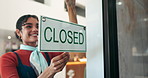 Waitress, woman and closed sign by cafe door for end of day, no service and message to customer. Storefront, signage poster and happy barista with info on glass for restaurant notice or advertisement