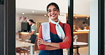 Happy waiter, face and woman by door of cafe for welcome, customer service and friendly hospitality. Small business, restaurant manager and arms crossed at entrance for bakery server or startup pride