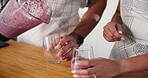 Hands, couple and pour smoothie in glass for breakfast, prepare milkshake and nutrition of healthy diet. People, liquid and organic ingredients with protein juice, weight loss and gut health at house