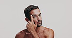 Beauty, cosmetics and face of shirtless man in studio for antiaging dermatology, treatment or wellness. Aesthetic, facial and skincare with model on white background for morning moisturizing routine