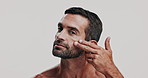 Skincare, cosmetic and face of man in studio for natural, health and facial routine for glow. Portrait, confident and male person from Brazil with hydration dermatology treatment by white background.