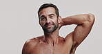 Skincare, laughing and face of man in studio for natural, health and facial routine for glow. Portrait, hygiene and male person from Brazil with hydration dermatology treatment by white background.