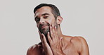 Skincare, beard and man in studio for natural, health and facial routine for glow. Portrait, confident and male person from Brazil with face hydration dermatology treatment by white background.