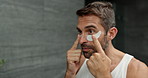 Eye mask, skincare and man in bathroom, wellness and treatment for dark circles, patches or hygiene. Person, house and guy with cosmetics product, beauty and glow with grooming, shine and aesthetic