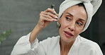 Mirror, skincare and woman with rose quartz, wellness and lymphatic drainage cosmetics. Bathroom, reflection or lady with jade roller, anti aging or facelift, massage for collagen and mature person