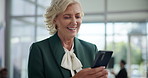 Mature, happy woman and laughing with phone for funny joke, conversation or chat at office. Female person, employee or executive with smile on mobile smartphone for comedy, humor or social media app