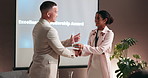 Happy, businessman or handshake with award for trophy, excellent leadership or milestone at seminar. Male person, leader and shaking hands with smile for congratulations, thank you or offer at office