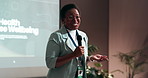 Black woman, presentation and screen with mic for seminar, conference or convention at office. Female person, African speaker or speech with staff for mental health training or wellbeing at workshop