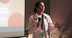 Conference, speaker and businesswoman on stage with presentation on leadership development in office. Microphone, public speaking and hr director with pitch at corporate seminar, event or workshop.